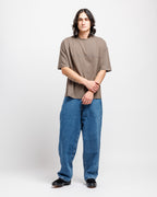 Cabin Smoke | On Model Front Person wearing a brown t-shirt and blue jeans on a white background