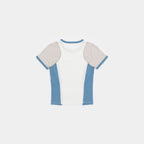 Cougar Milk / Frostbite Blue / Silver Tip | Back A short-sleeve ringer t-shirt with a white body, light beige shoulder panels, and dusty blue side panels and collar trim, shown flat on a light gray background.