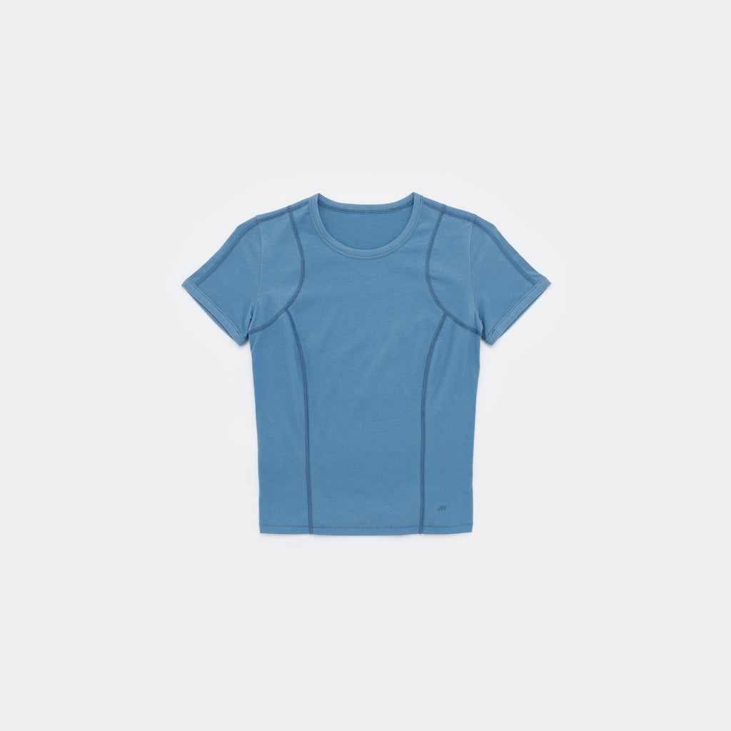 A short-sleeve athletic t-shirt in a dusty medium blue color, laid flat against a light gray background.