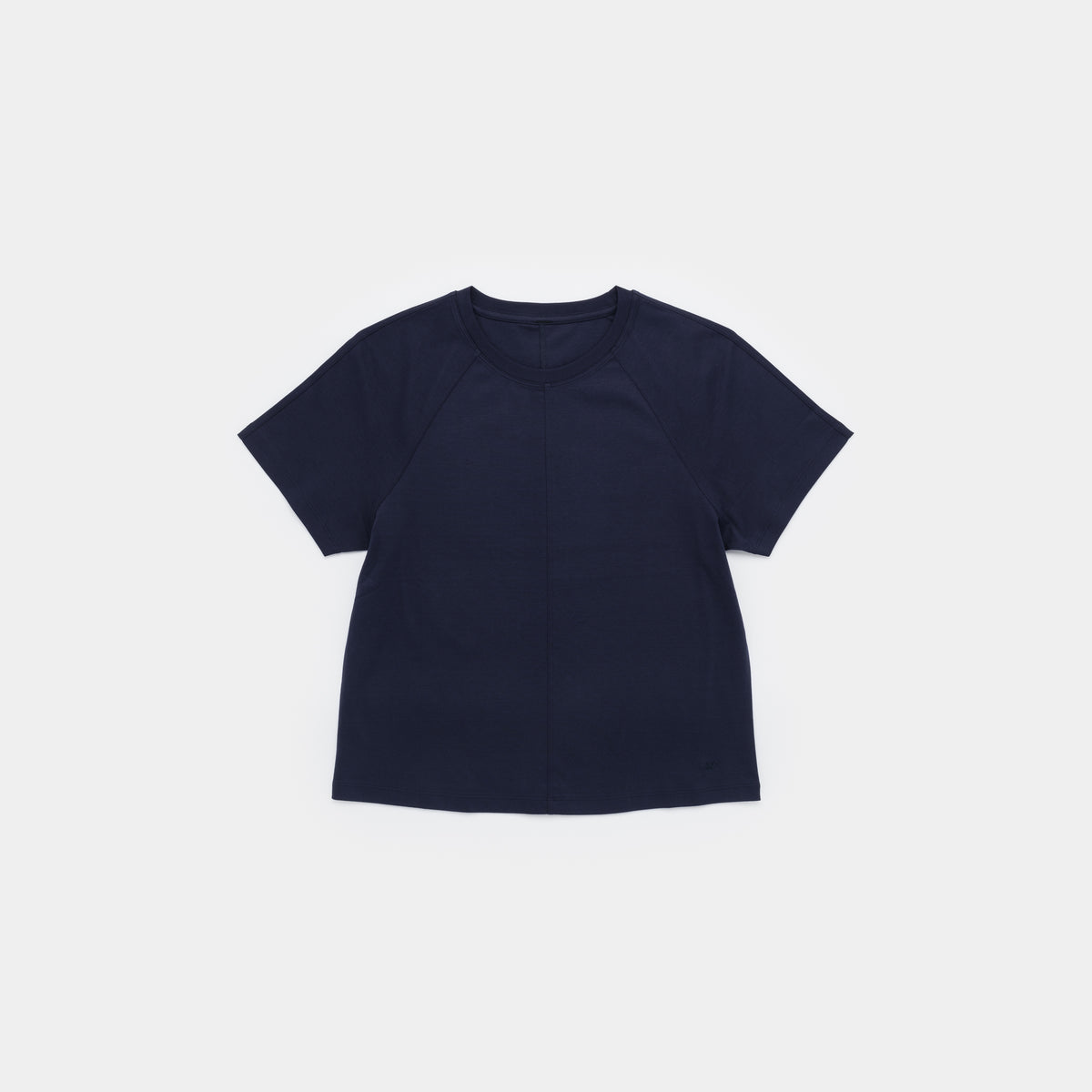 A dark navy blue short-sleeve crop top with raglan sleeves, laid flat against a light gray background.