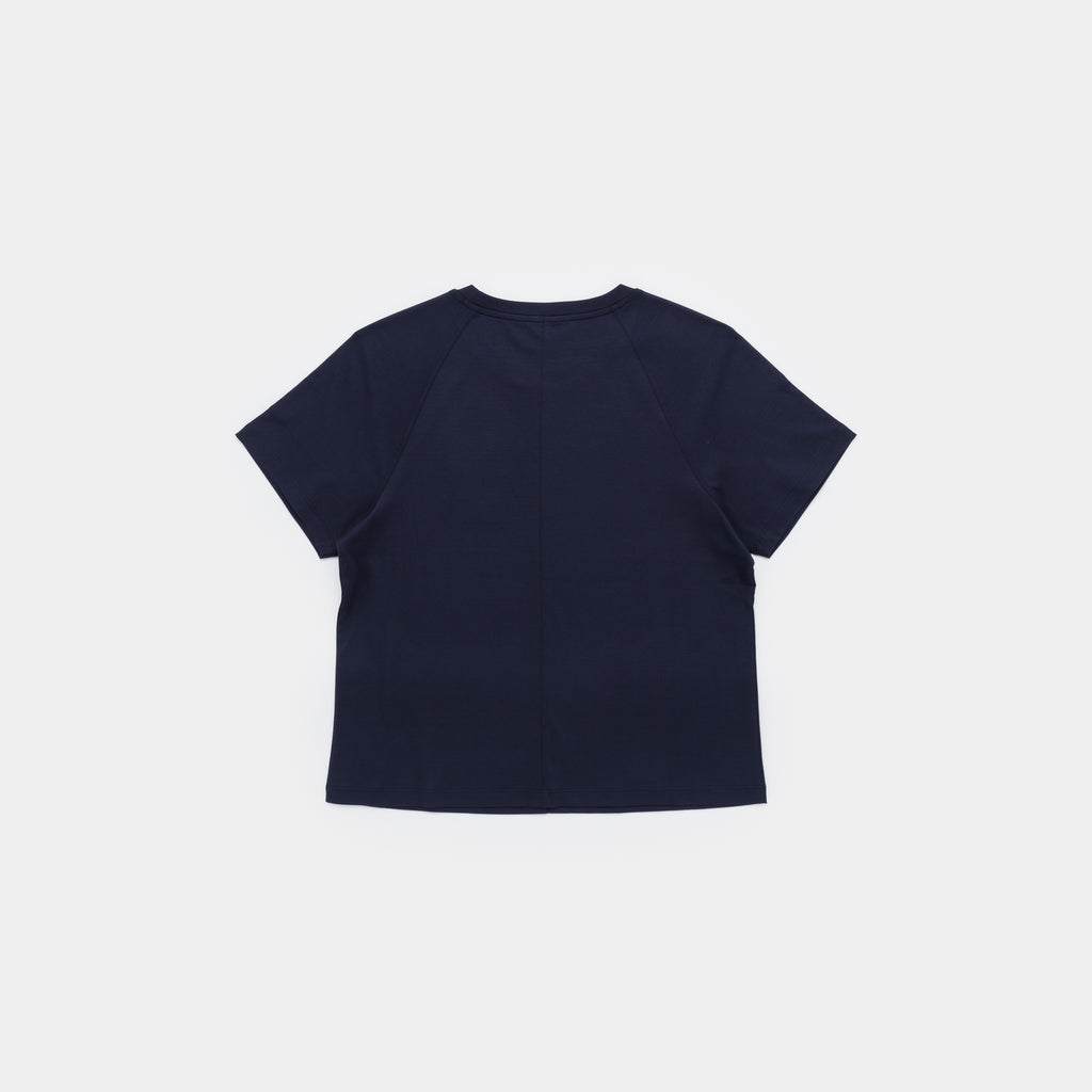 A navy blue short-sleeve crop top shown from the back, laid flat against a light gray background.