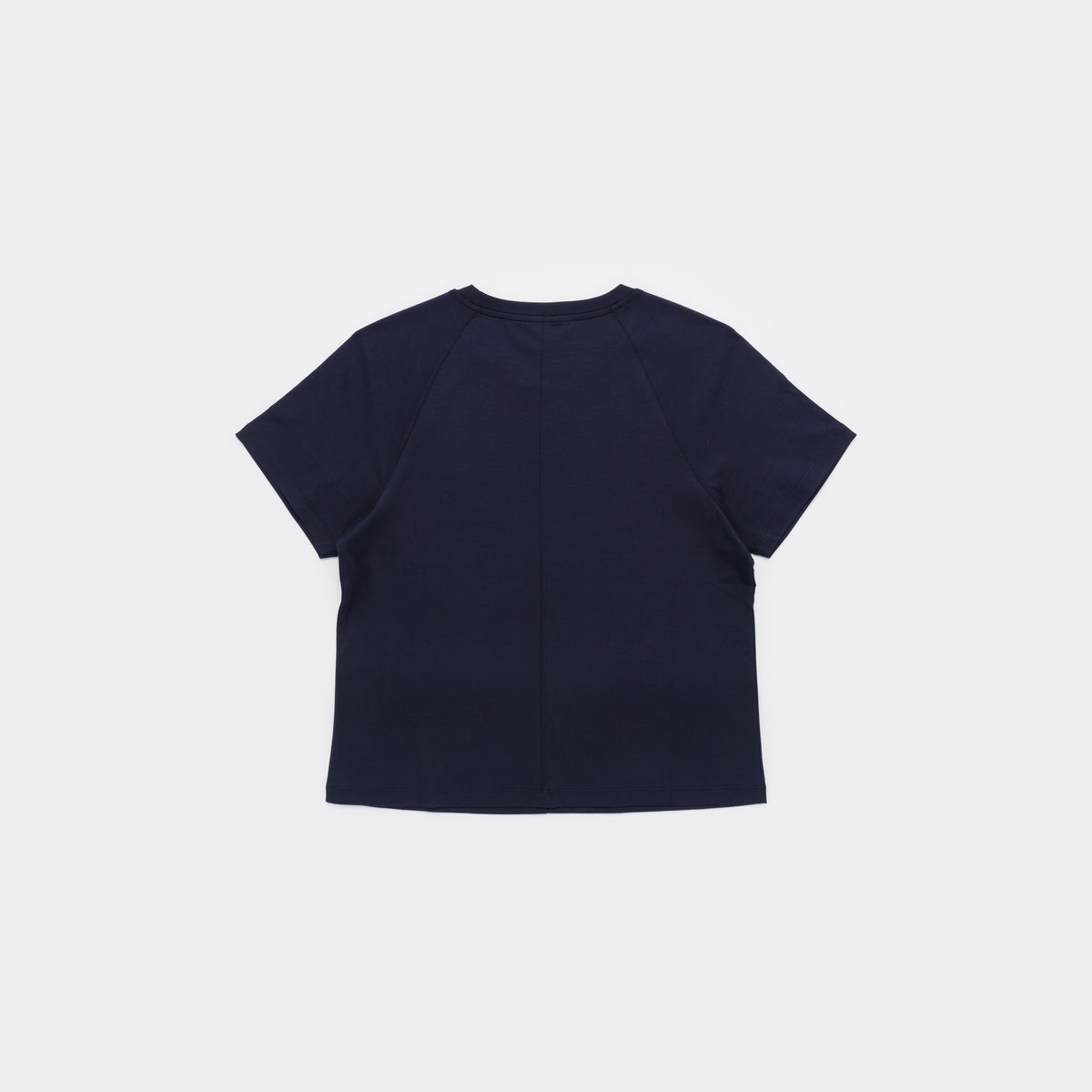 A navy blue short-sleeve crop top shown from the back, laid flat against a light gray background.