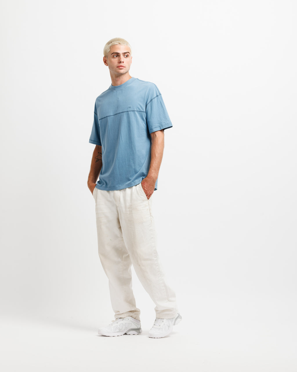Man wearing a nice blue tee.