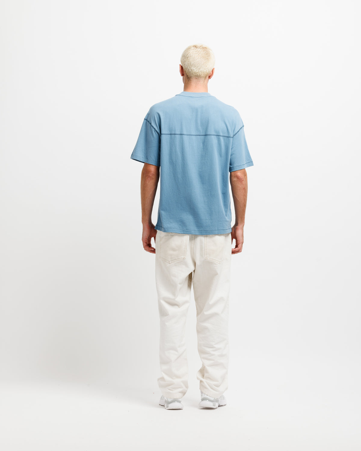 Man wearing a nice blue tee.