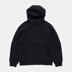 Ink Black | Front - A black pullover hoodie with a unique front zipper design and a small colorful embroidered logo on the lower right hem, displayed flat against a light gray background.