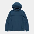 Stillwater Blue | Front A dark teal blue hooded sweatshirt with a unique architectural, panelized front design, laid flat against a light gray background.